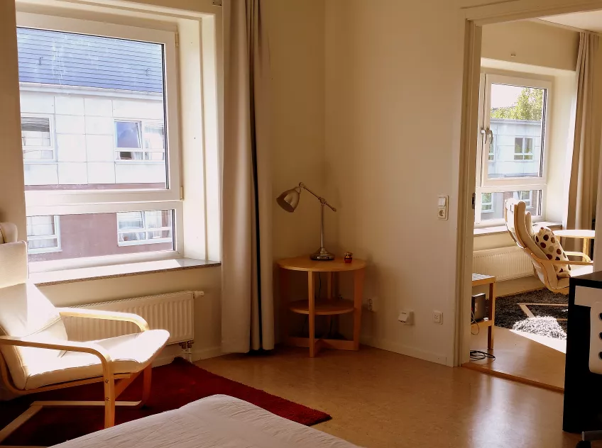 A picture of the interior of an apartment Klostergården Student House with a view of the kitchen taken from inside the bedroom (photo).