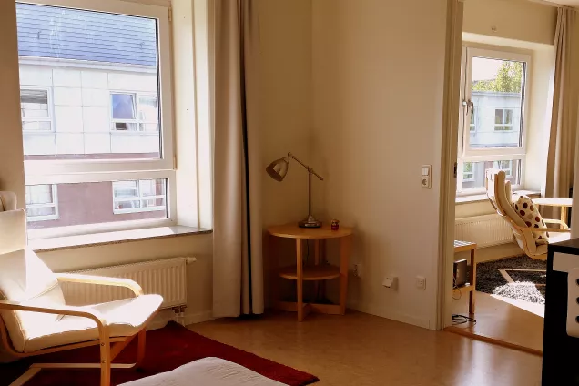 A picture of the interior of an apartment Klostergården Student House with a view of the kitchen taken from inside the bedroom (photo).