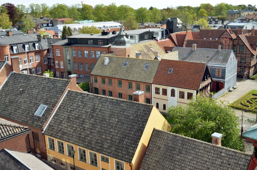 A birds eye view of the inner city of Lund showing the roof tops of several buildings (picture)